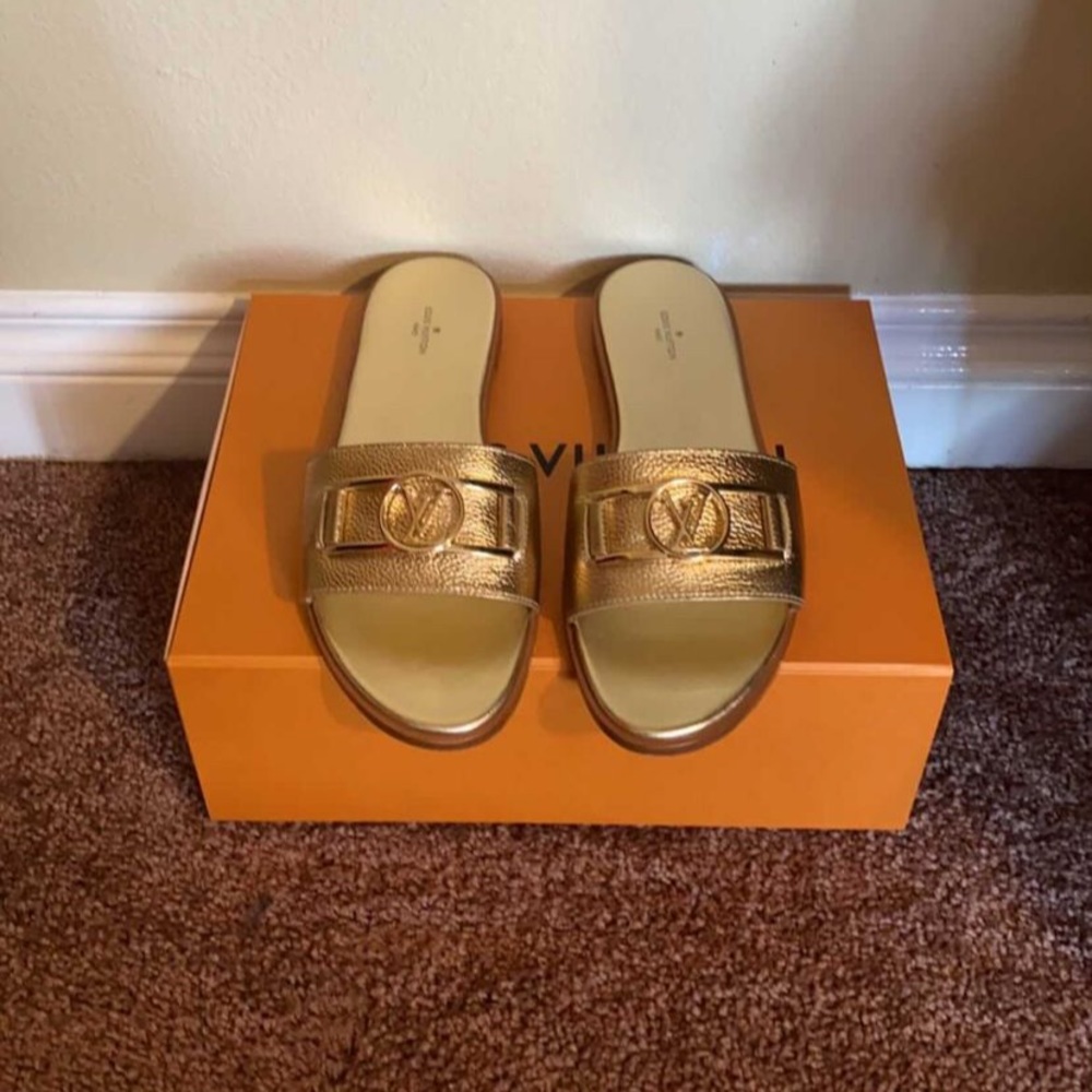 I am selling these worn once LV lock it flat mules